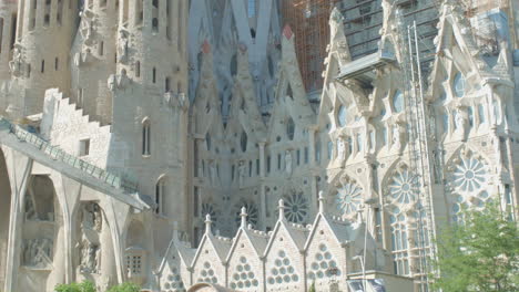 Street-Level-Mid-Shot-Of-La-Sagrada-Familia-With-Vehicles-Passing-By