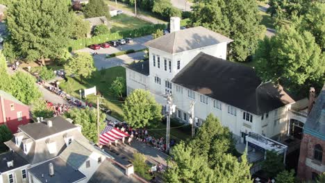 Steinman-Arts-Center-at-Linden-Hall,-American-flag-in-Independence-Day-celebration-parade