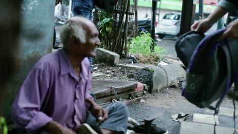 A-cobbler-repairing-slippers-of-pilgrims-by-the-roadside-in-the-morning-stock-footage-collection-16