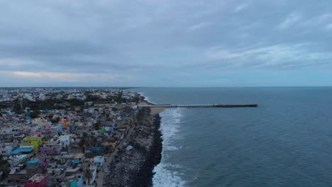 4k-aerial-view-of-a-Lighthouse-near-the-port-harbor-shot-with-a-drone-in-Pondicherry,-India