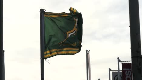 A-South-African-Springboks-flag-flying-during-the-Rugby-World-Cup,-slow-motion