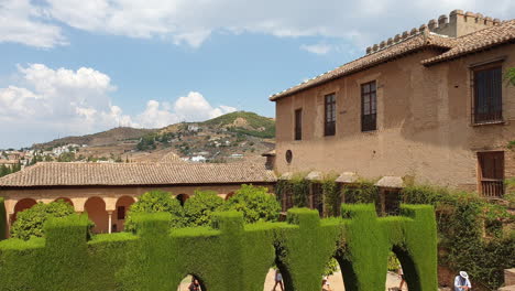 Tourists-walk-to-Palacio-Nazaries-in-Alhambra,-Granada,-Spain