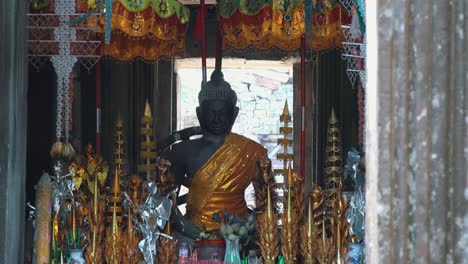 Tilt-Up-Of-Buddha-Statue-Inside-Temple
