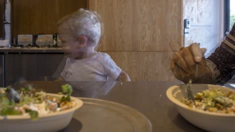 Time-lapse-of-blonde-baby-enjoying-Chipotle-burrito-bowls