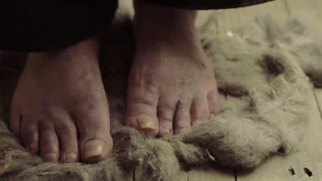 Desperate-dirty-bare-feet-walking-on-dusty-floor