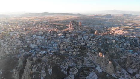 Aerial-view-to-Uçhisar-fortress-in-Goreme-Cappadocia,-Turkey