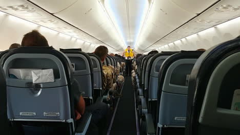 Cabin-crew-shows-passengers-use-of-life-vest