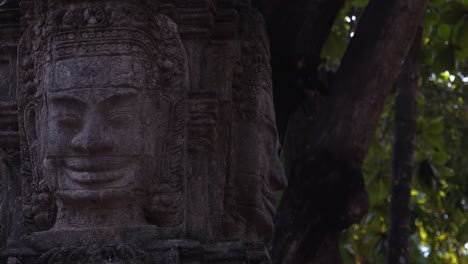 Slider-Shot-Showing-Khmer-Stone-Statue-With-Trees-in-the-Background
