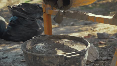 Filling-bucket-with-cement-SLOW-MOTION