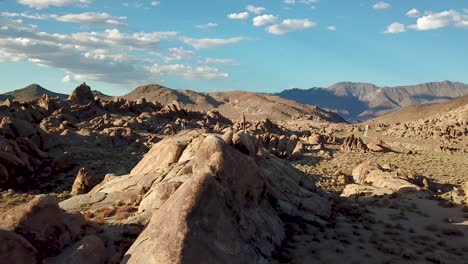 Group-of-Hikers-on-Sandstone-Hills-in-Desert-Under-Alabama-Hills,-California-USA,-Aerial-View