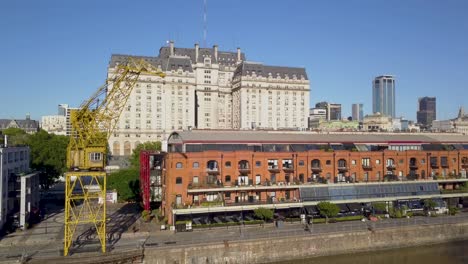 Aerial-of-a-loading-crane-and-an-original-warehouse-in-Puerto-Madero-neighborhood