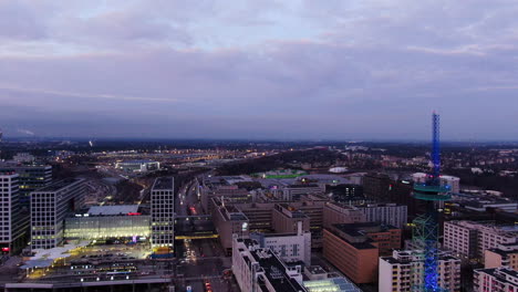 Aerial-drone-view-of-Elisa-communication-tower-in-Pasila,-Helsinki-Finland