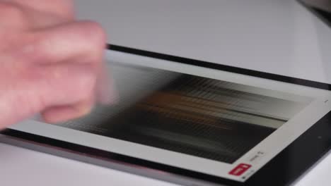 Browsing-on-pinterest-from-a-tablet,-Time-Lapse-Close-Up