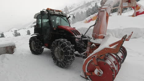 Tractor-clearing---blowing-heavy-snowfall-from-snow-covered-street