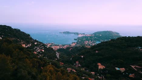Drone-moving-forward-filming-view-of-Saint-Jean-Cap-Ferrat-from-Mont-Leuze