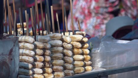Close-Exterior-Static-Shot-of-Bananas-on-Sticks-on-the-Street-Food-Stall-in-the-Day