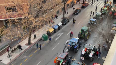Top-view-of-a-line-of-tractors-in-a-protest-in-Spain-due-to-the-precarious-prices