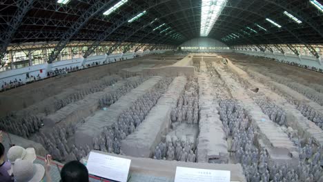 Tourists-inside-the-museum-site-building-containing-Terracota-Army-sculptures,-Xian,-Shaanxi-Province,-China