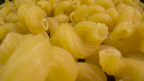 Close-up-traveling-across-a-bunch-of-tortiglioni-pasta