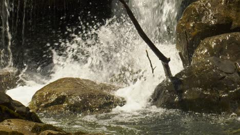 Water-splashing-onto-rocks-in-a-stream-in-Pyrenees,-Spain