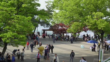 A-crowd-of-Tourists-takes-a-walk-at-Namsan-mountain-N-tower-area-Seoul,-top-view