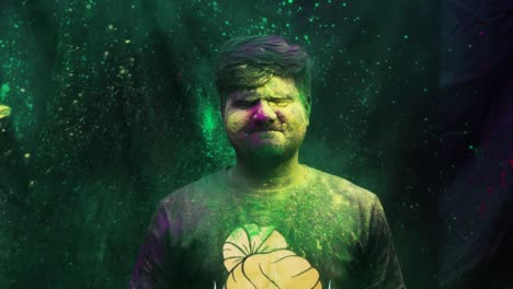 Young-adult-man-celebrating-holi-with-colors