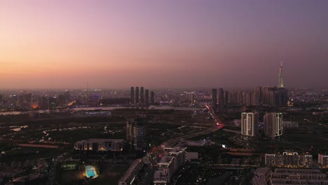 Aerial-crane-shot-of-new-luxury-apartment-developments-along-the-Saigon-river-in-Ho-Chi-Minh-City-at-dusk-with-beautiful-colored-sky-and-detail-of-architecture