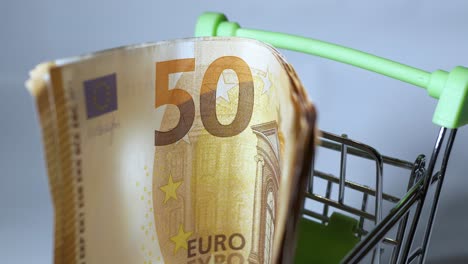 The-euro-is-taken-from-your-shopping-cart-with-your-fingers