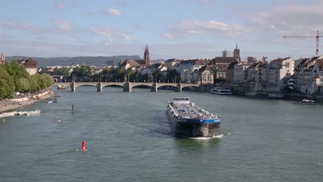 Close-up-on-transport-ship-sail-through-Rhine-River,-Basel,-Switzerland