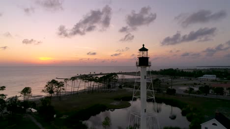 Aerial-flight-around-a-lighthouse-during-beautiful-sunset