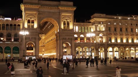 Galleria-Vittorio-Emanuele-II-night-timelapse-with-duomo-piazza-in-foreground,-still-wide-shot-with-motion-blur