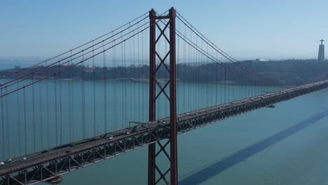 Real-Time-Aerial-Drone-Shot-of-the-25th-of-April-Bridge,-in-Lisbon,-Portugal