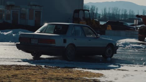 Old-modified-drifting-car-spins-out-of-the-slippery-track-during-a-winter-day
