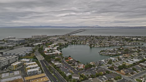 Foster-City-California-Aerial-v1-flyover-urban-residential-neighborhood-towards-lincoln-centre-life-sciences-research-campus-with-san-mateo-bridge-and-bay-views---Shot-with-Mavic-3-Cine---June-2022