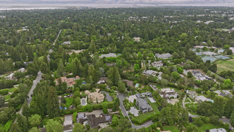 Atherton-California-Aerial-v8-birds-eye-view-flyover-wealthy-neighborhood-capturing-gated-and-hedged-luxury-homes,-multimillion-properties-in-an-idyllic-community---Shot-with-Mavic-3-Cine---June-2022