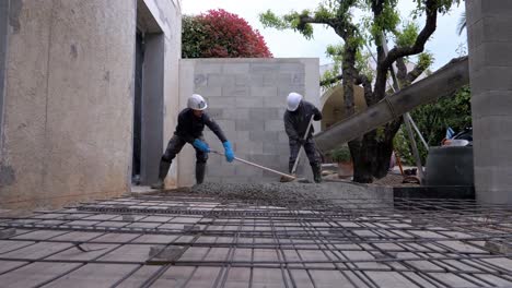 Construction-workers-using-trowels-to-get-the-cement-everywhere
