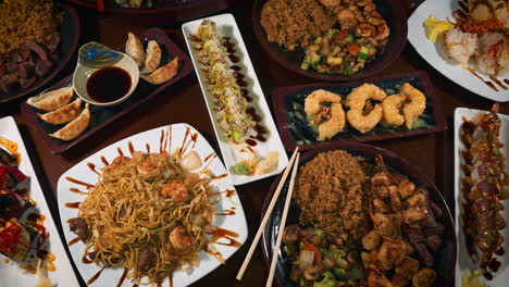 Japanese-hibachi-restaurant-menu-offerings,-appetizers-dinners-sushi,-slider-top-down-4K