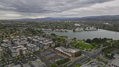 Foster-City-California-Aerial-v3-drone-flyover-town-center-capturing-central-lake-and-lakeside-residential-neighborhood-with-waterfront-apartment-complex---Shot-with-Mavic-3-Cine---June-2022