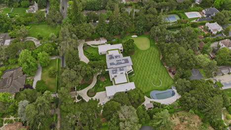 Atherton-California-Aerial-v6-fly-around-high-end-mansion,-single-family-home-with-modern-architectural-designs-in-residential-neighborhood-with-open-green-space---Shot-with-Mavic-3-Cine---June-2022