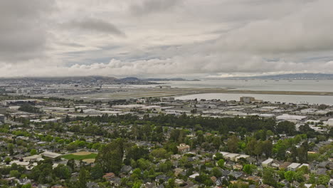 Burlingame-California-Aerial-v2-panoramic-panning-view-capturing-charming-easton-addition-neighborhood-with-leafy-streets,-sfo-airport-with-san-francisco-bay-views---Shot-with-Mavic-3-Cine---June-2022
