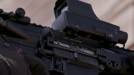 Assault-rifle-R20-firing-bullets,-ejection-port-closeup,-bullet-cases-flying-out,-slow-motion