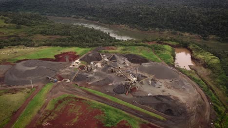 Aerial-shot-of-rock-piles-and-excavators-working-in-open-stone-quarry-in-Brazil