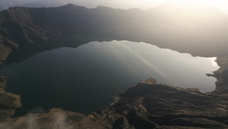 Aerial-Drone-Above-Quilotoa-Crater-Ecuatorian-Water-Volcano,-Indigenous-Highland-Peak,-Golden-Sunlight-in-Travel-Destination,-Ecuador,-South-America