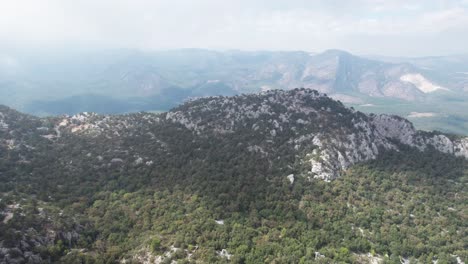 AERIAL---Epic-view-over-the-valley-of-Termessos,-Turkey,-spinning-shot