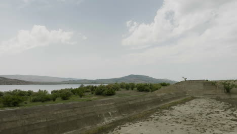 Concrete-dyke-and-bushes-above-Dalis-Mta-reservoir-dam-in-Georgia