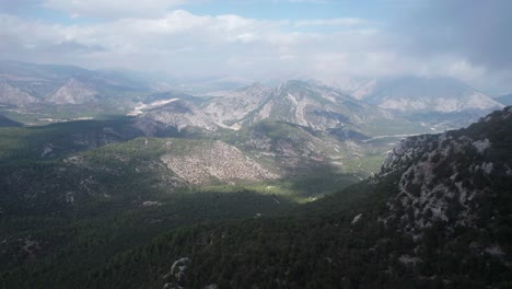 AERIAL---Epic-shot-over-the-valley-of-Termessos,-Turkey,-rising-shot