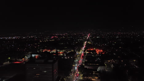 San-Jose-California-Aerial-v1-drone-flyover-east-santa-clara-street-from-busy-downtown-across-neighborhoods-capturing-heavy-traffics-at-night---Shot-with-Mavic-3-Cine---June-2022