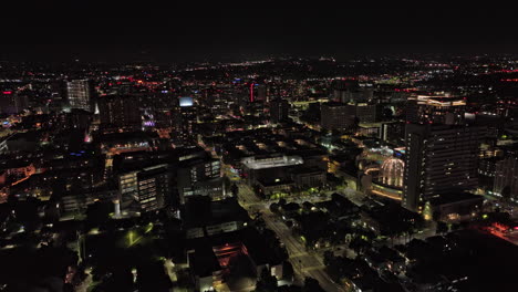 San-Jose-California-Aerial-v3-cinematic-drone-flyover-and-around-downtown-capturing-illuminated-cityscape,-state-university-campus-area-and-city-hall-at-night---Shot-with-Mavic-3-Cine---June-2022