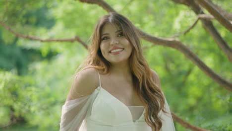 Beautiful-Latina-Bride-on-Outdoor-Summer-Wedding-Day-with-Big-Pretty-Smile-and-in-a-Pretty-White-Dress