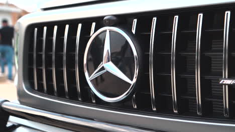 Frankfurt,-Germany,-27-July-2022:-Close-up-Mercedes-Benz-logo-car-on-cross-road-luxury-suv-car-G-Class-AMG-3-hood